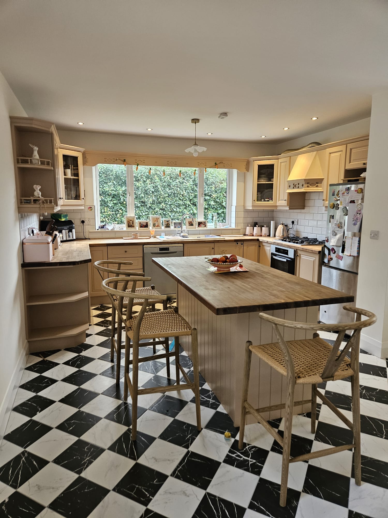 Sage green hand painted kitchen with decorative tiles in Limerick